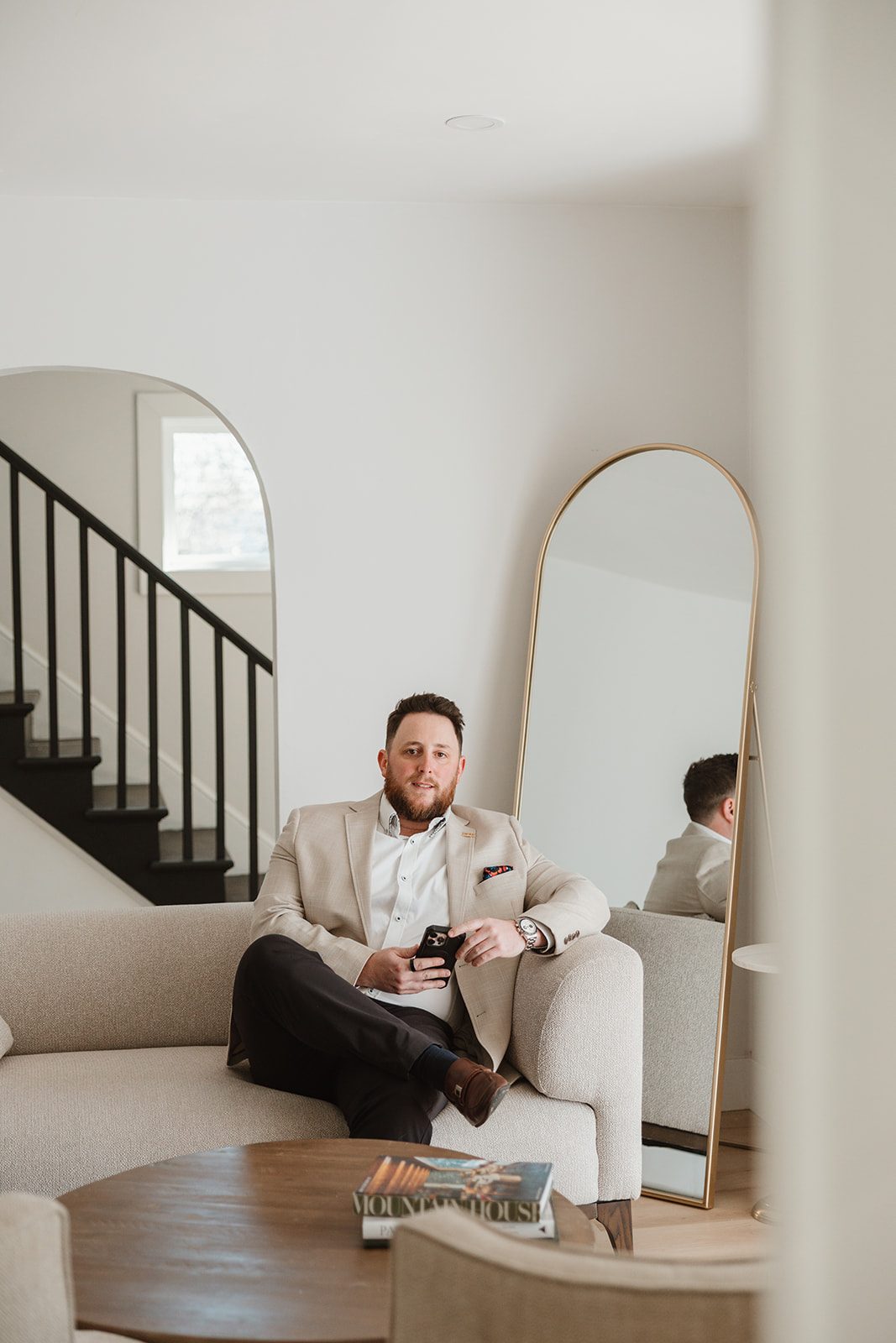 Founder seated portrait near mirror