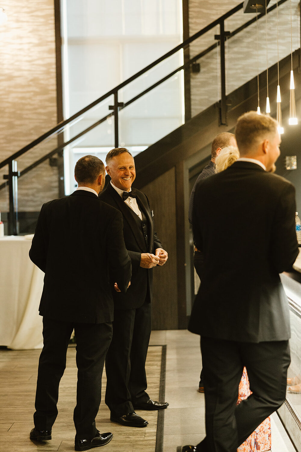 Colleagues in conversation near the staircase