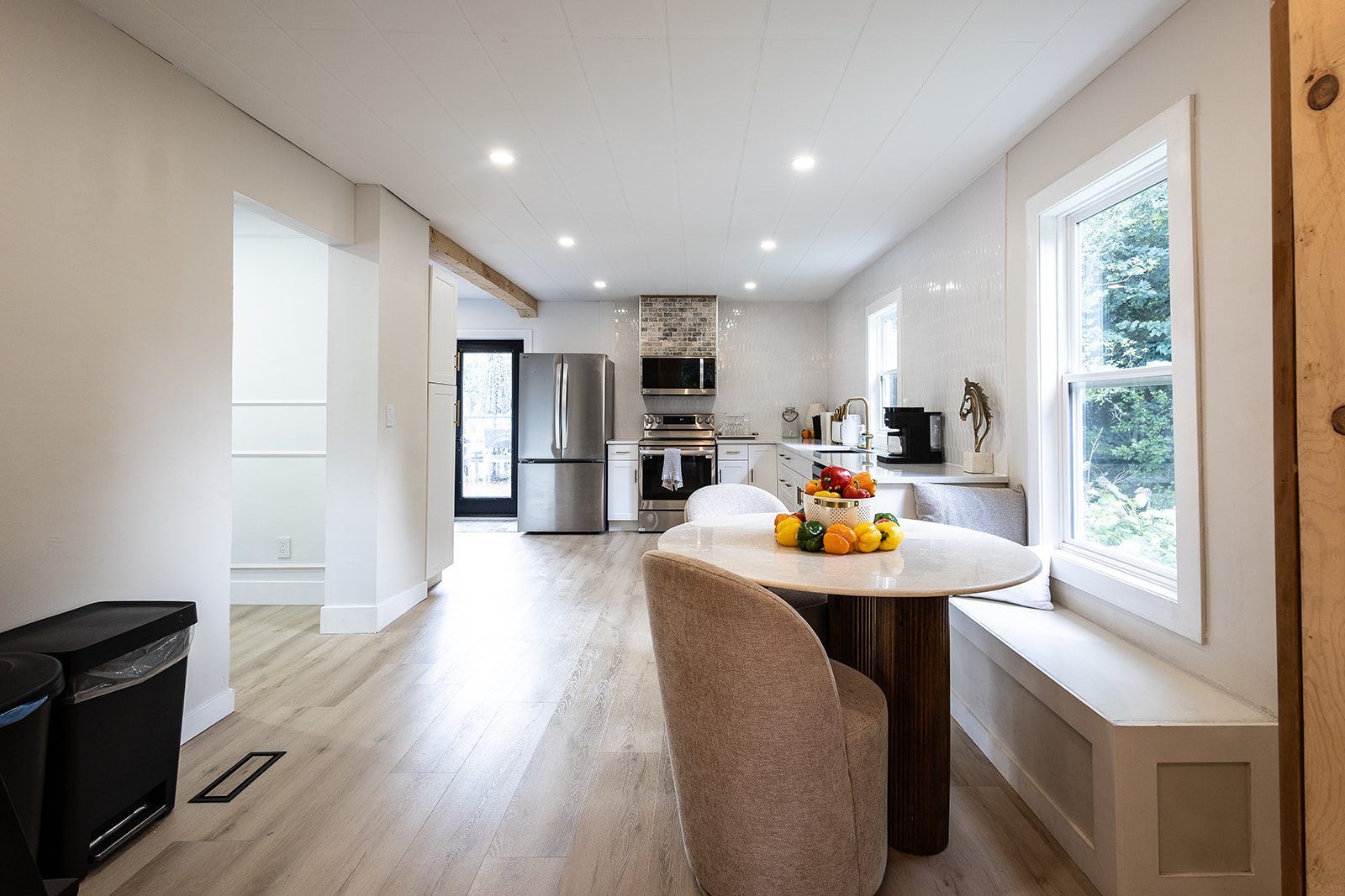Kitchen with round breakfast table and window bench