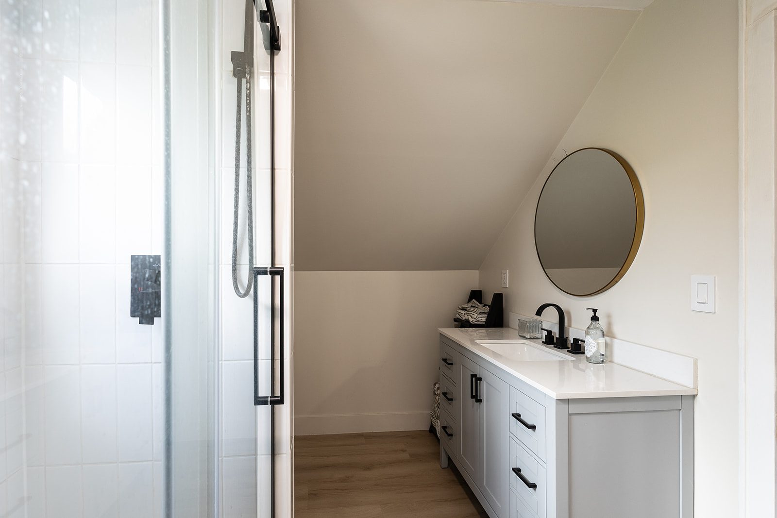 Bathroom vanity with round mirror