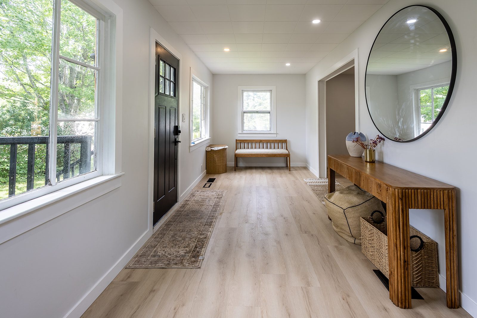 Entryway hallway with black front door